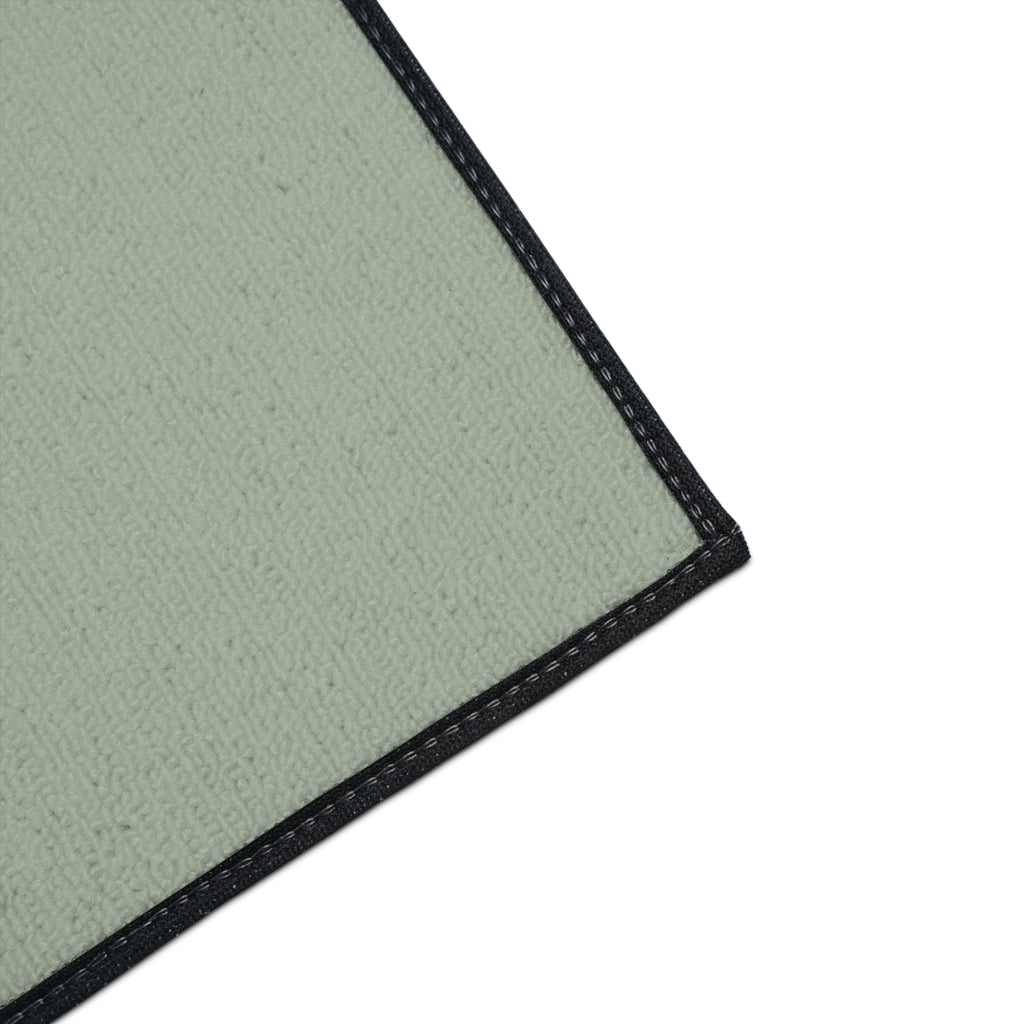 Detailed corner view of Moooove Over Cancer mat with black trim