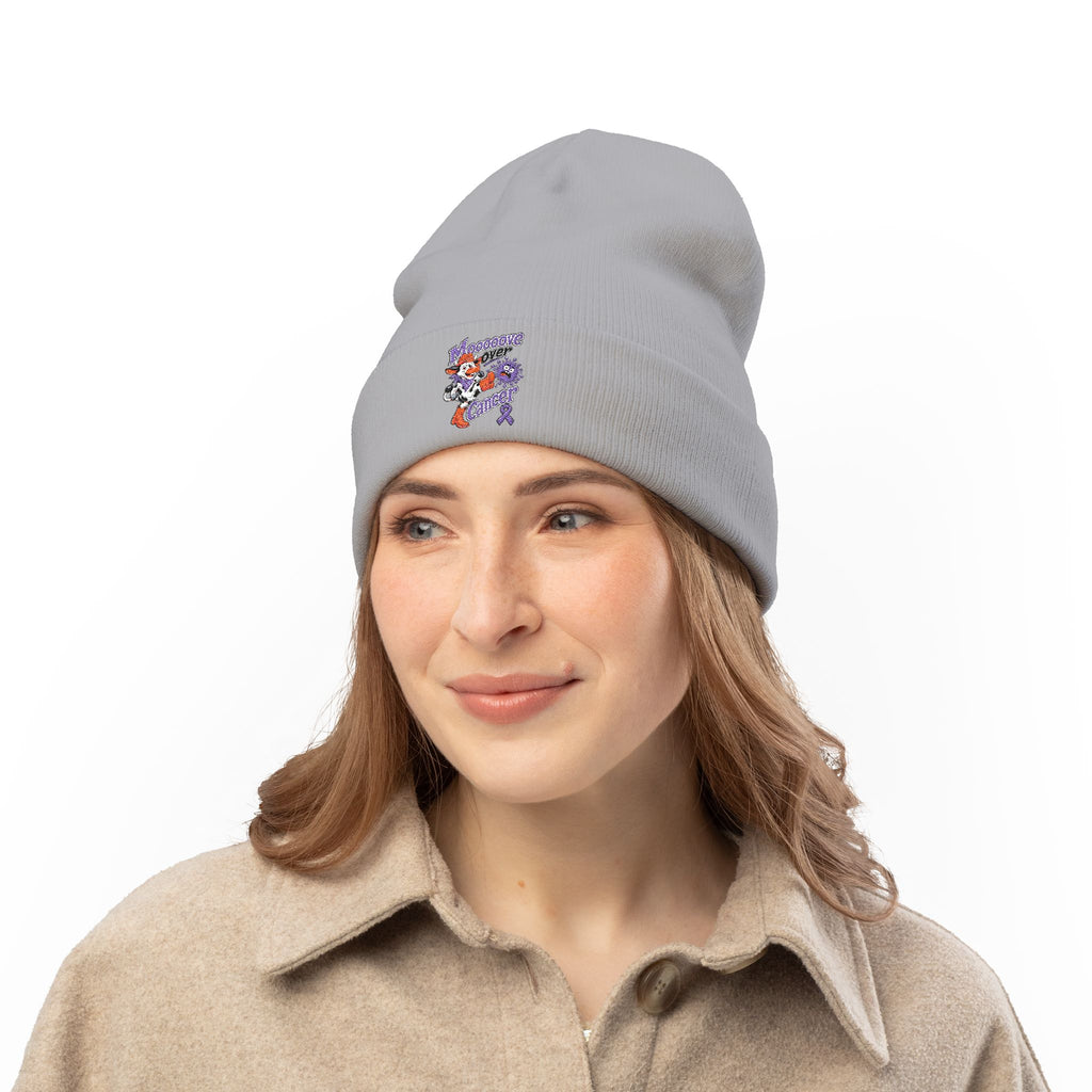 Woman wearing a gray Moooove Over Cancer embroidered beanie