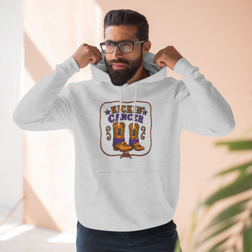 Model wearing a gray Kickin' Cancer hoodie with cowboy boots artwork