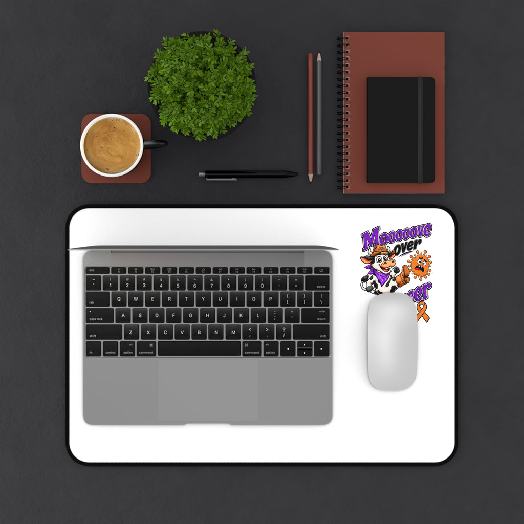 Moooove Over Cancer desk mat holding a laptop and mouse, with Leukemia/Kidney Cancer awareness ribbon