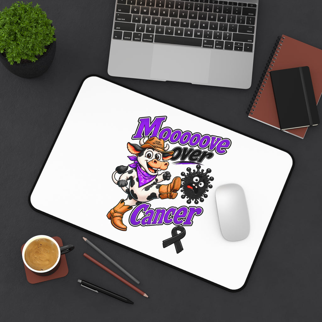 Moooove Over Cancer mouse pad shown diagonally with a laptop and mouse