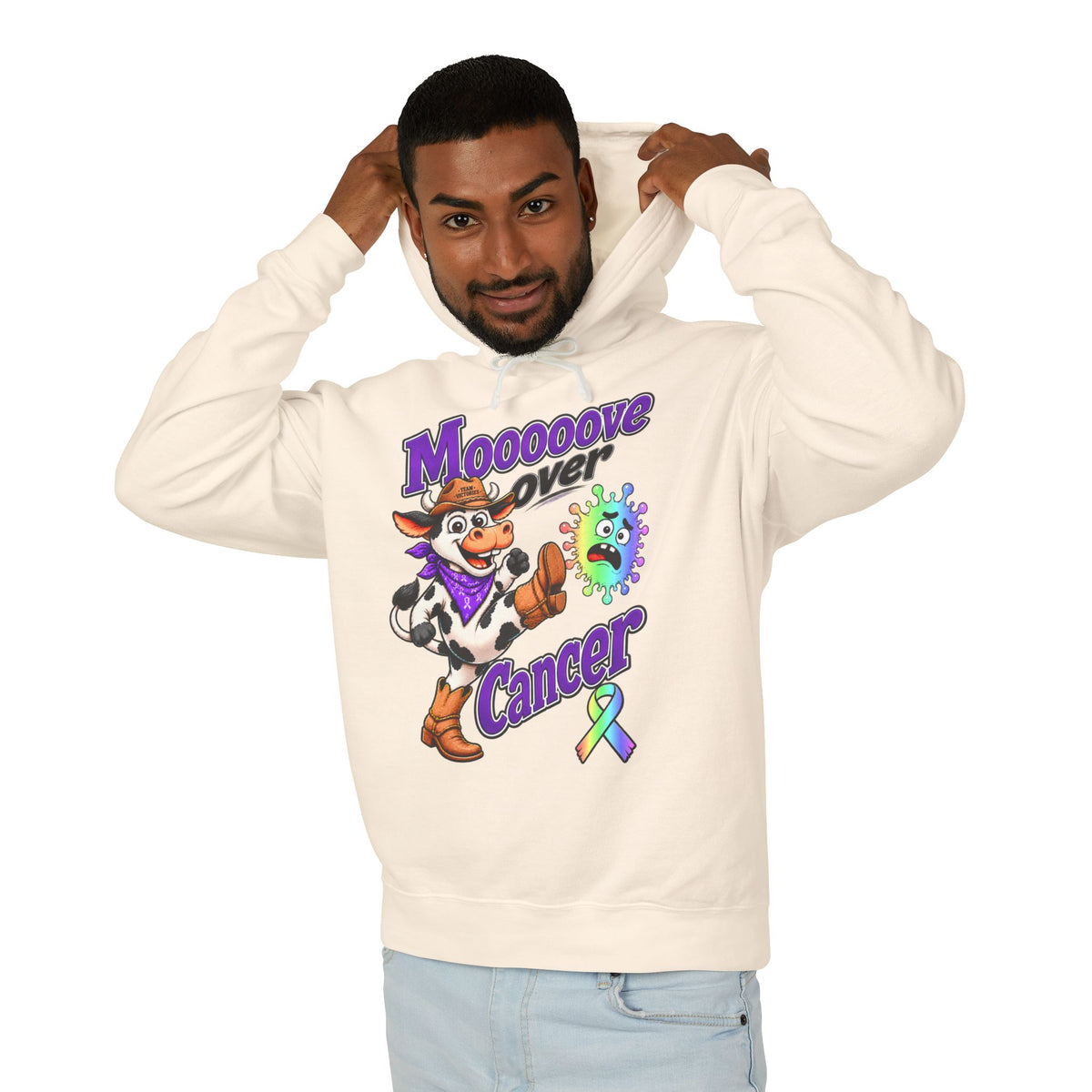 Model wearing a cream Moooove Over Cancer hoodie with an all-cancer awareness ribbon