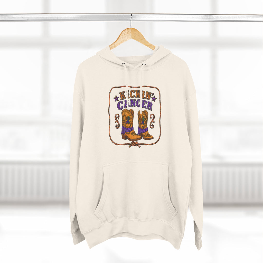 Cream Kickin' Cancer hoodie hanging from a wooden hanger