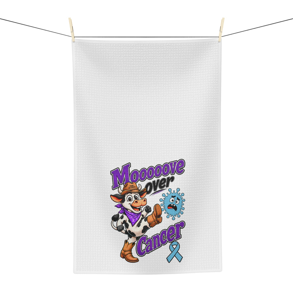 Moooove Over Cancer tea towel hanging on a line with cow artwork and blue awareness ribbon