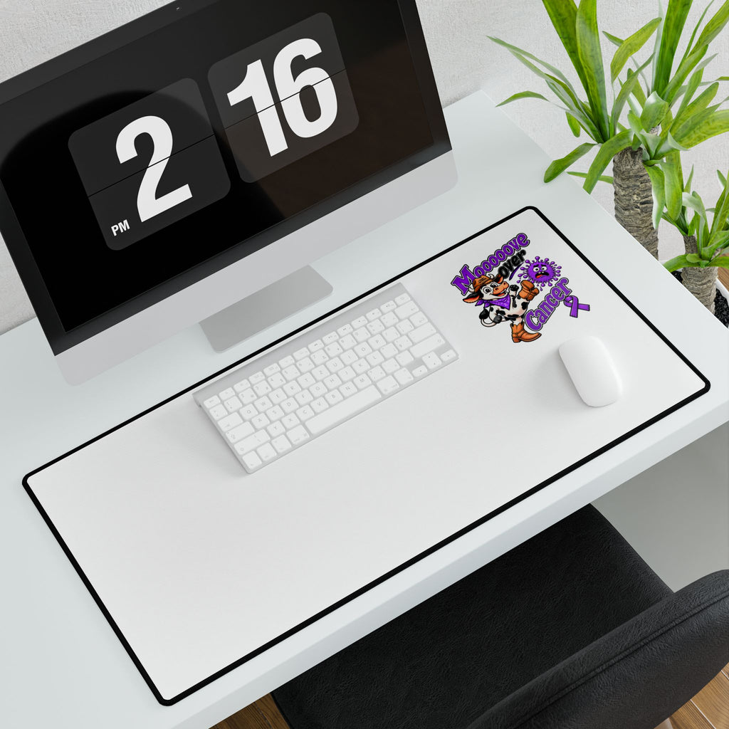 Moooove Over Cancer desk mat on a workstation with Pancreatic Cancer awareness ribbon artwork
