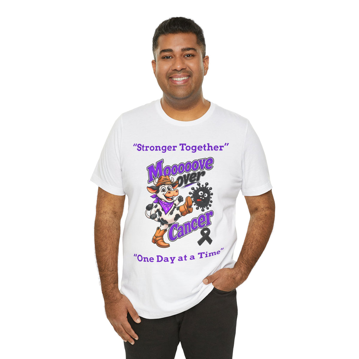 Man wearing a white Moooove Over Cancer T-shirt with Western cancer-support artwork