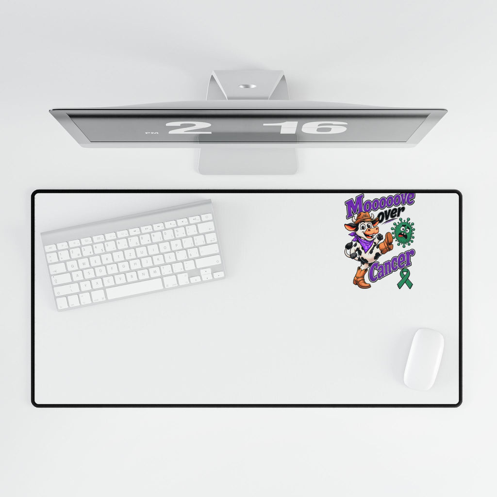 Moooove Over Cancer desk mat with keyboard and mouse in an overhead view