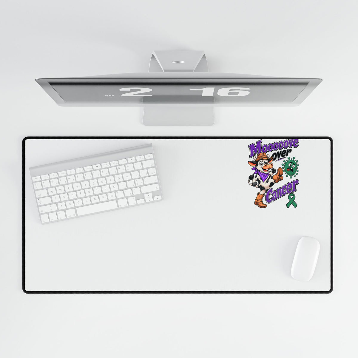 Moooove Over Cancer desk mat with keyboard and mouse in an overhead view
