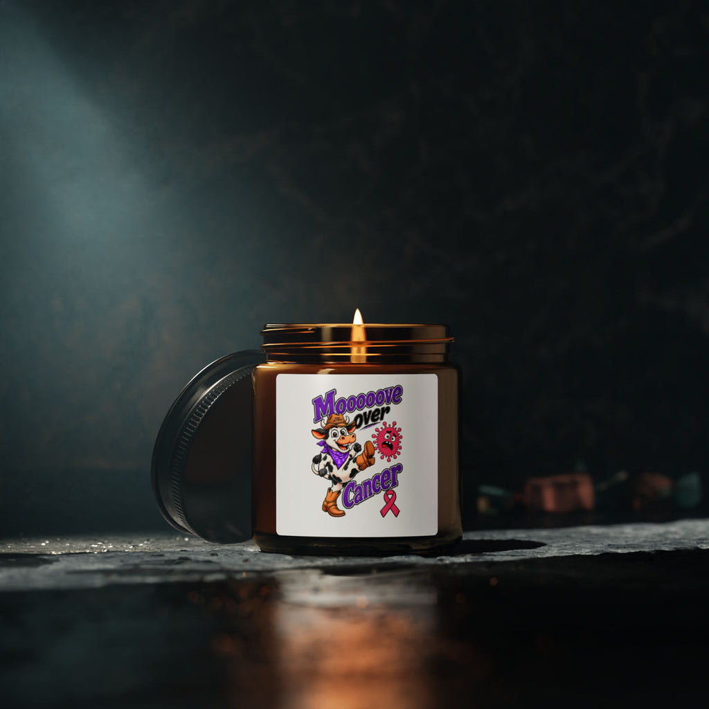 Moooove Over Cancer candle with lid beside it, featuring a pink Breast Cancer awareness ribbon