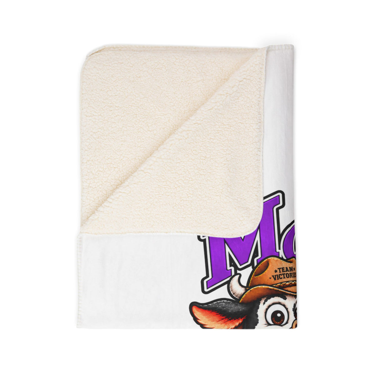 Close-up of Moooove Over Cancer sherpa blanket with cream reverse and printed cow character