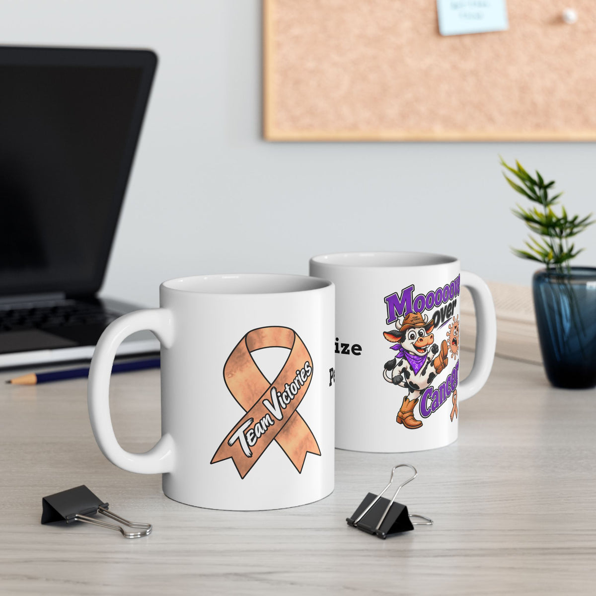 Two Moooove Over Cancer mugs displaying the cow design and Uterine Cancer awareness ribbon