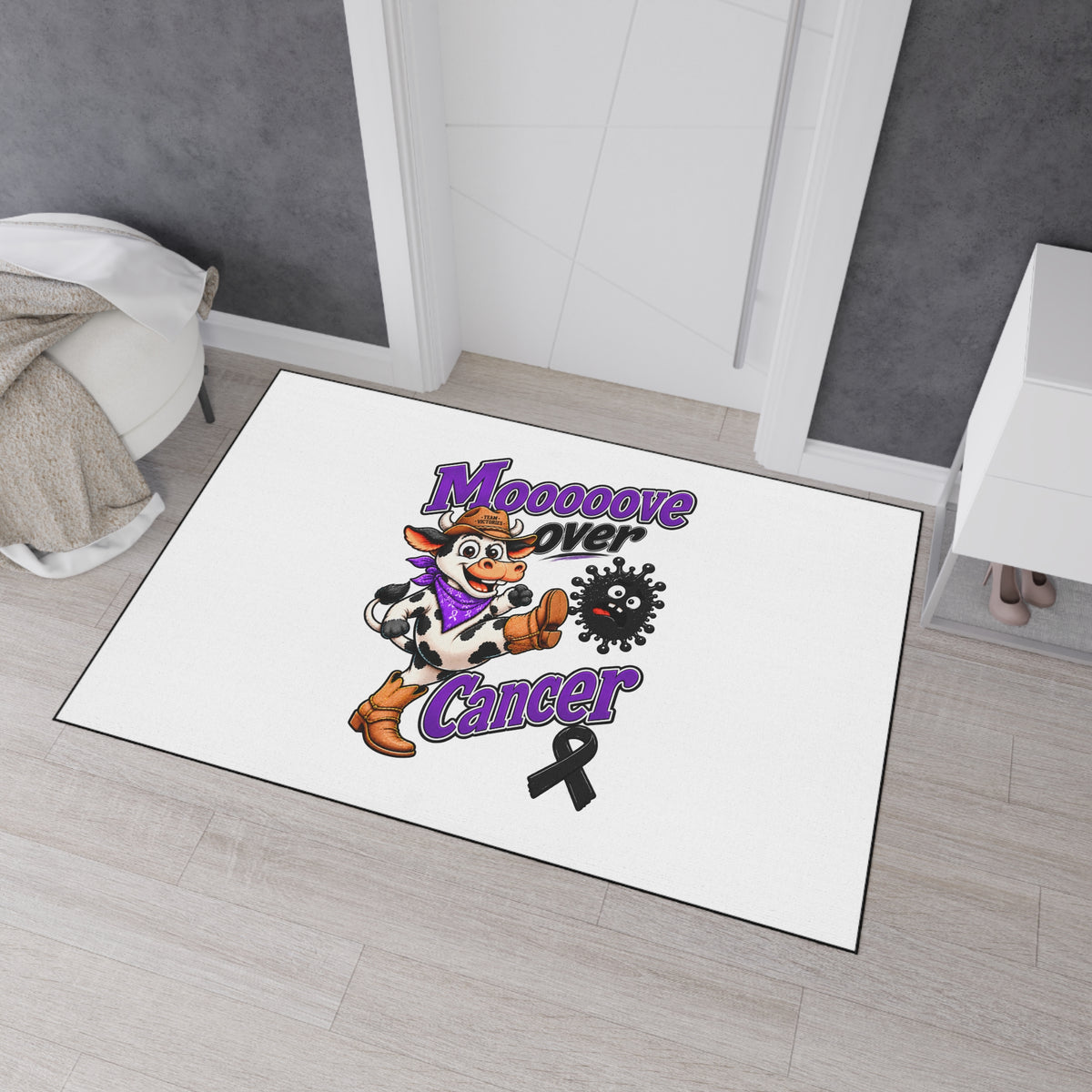 Moooove Over Cancer black ribbon entry rug displayed in a bedroom