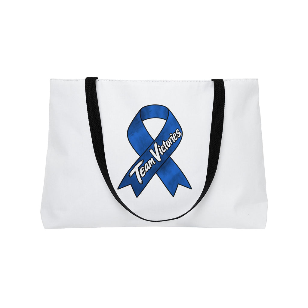 Back of white Moooove Over Cancer tote featuring a blue Team Victories ribbon