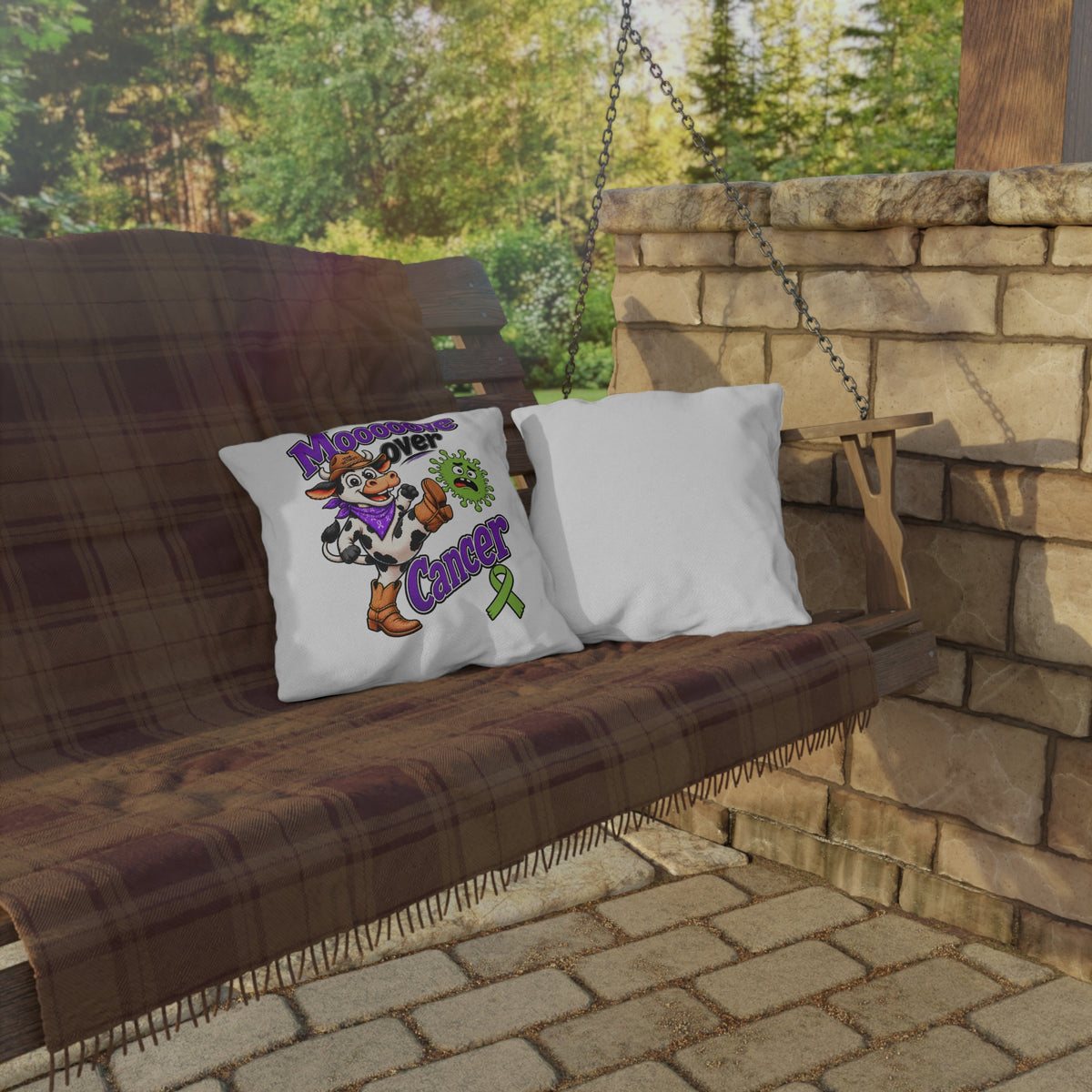 Moooove Over Cancer pillow displayed on an outdoor porch swing with a cow and green ribbon design