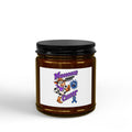 Moooove Over Cancer soy candle in an amber jar with a blue ribbon design