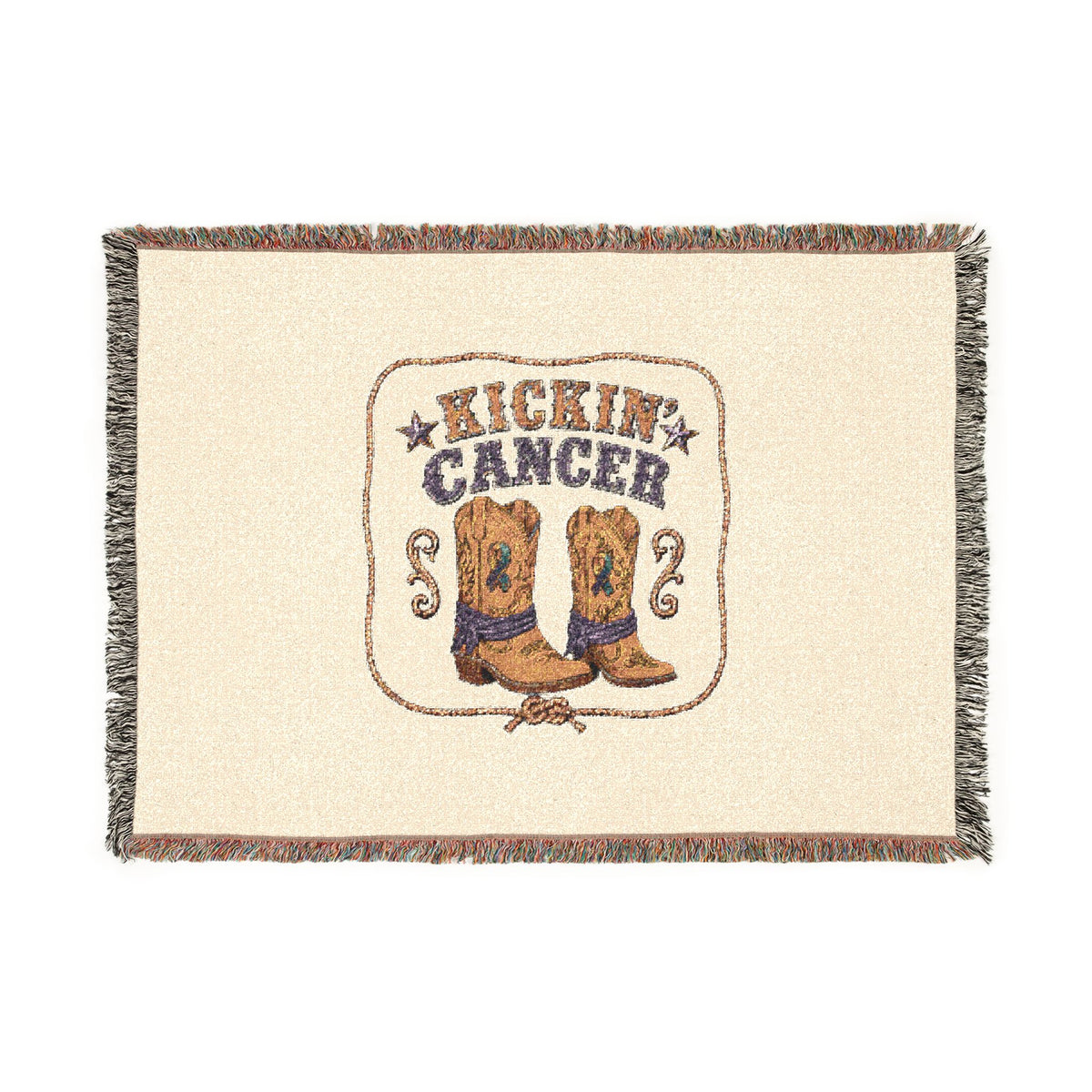 Flat view of the Kickin' Cancer woven blanket showing cowboy boots, message, and fringed edges