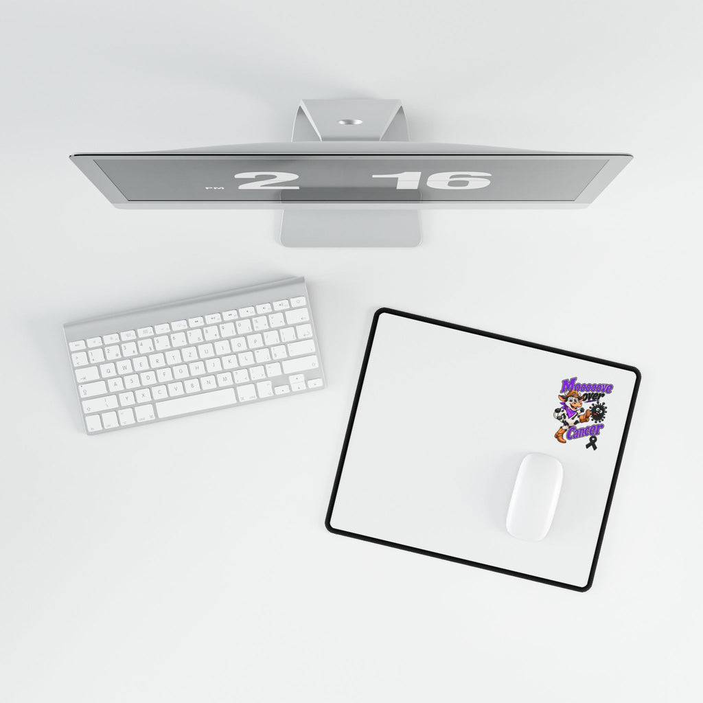Moooove Over Cancer desk mat shown with a white mouse in a workspace setting