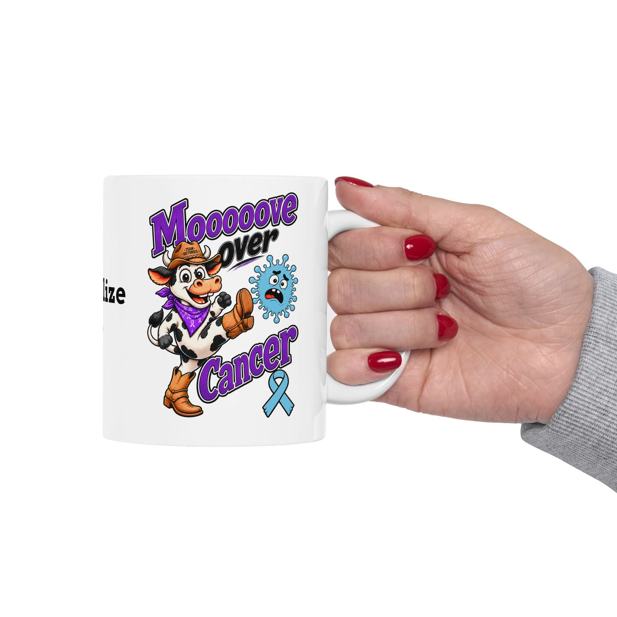 Hand holding a Moooove Over Cancer personalized ceramic mug