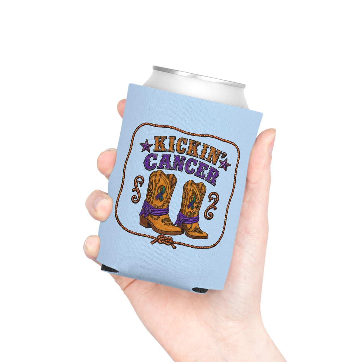 Hand holding a light blue Kickin' Cancer can cooler with western boot artwork