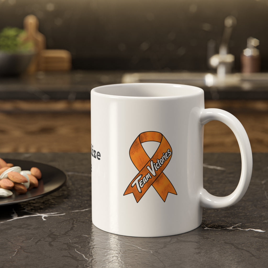 Moooove Over Cancer Team Victories mug with orange ribbon on a kitchen counter