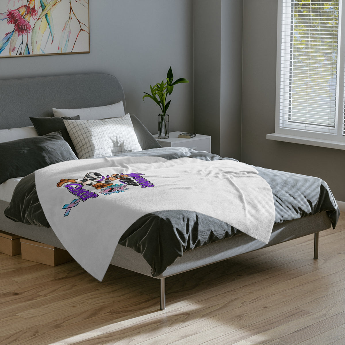 Moooove Over Cancer microfiber blanket spread across a bed