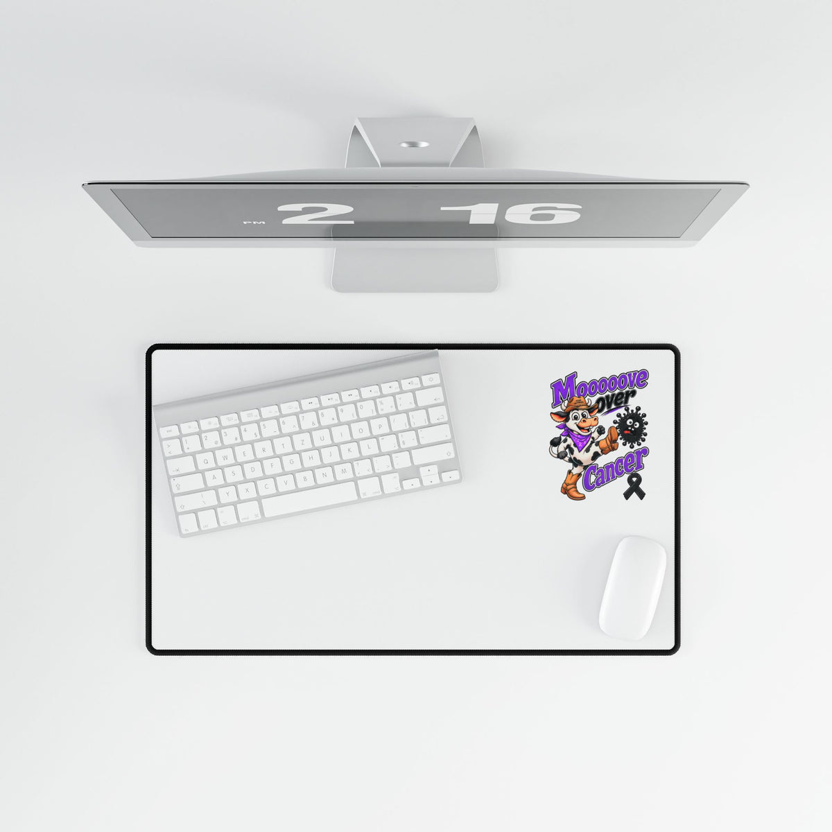 Moooove Over Cancer desk mat in a clean desktop setup with keyboard and mouse