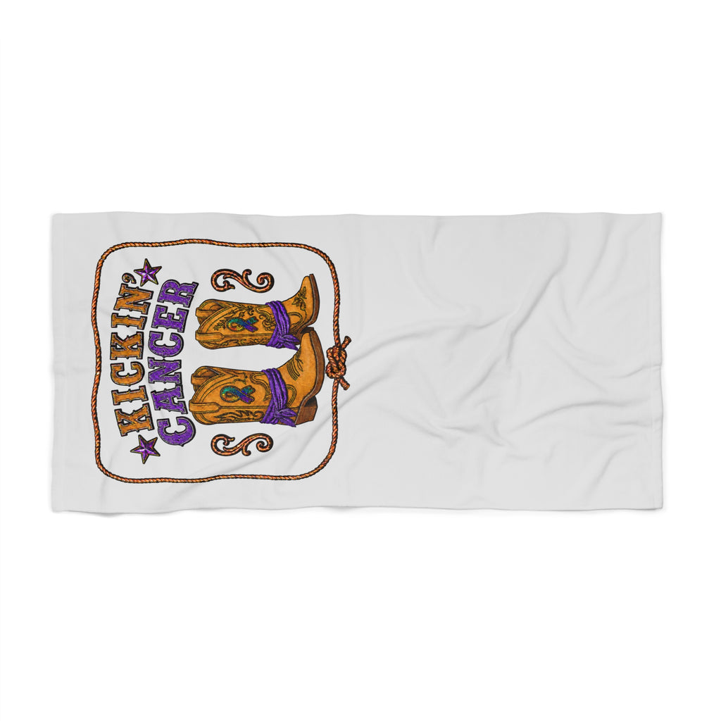 Beach towel laid flat with Kickin' Cancer western-inspired boot design