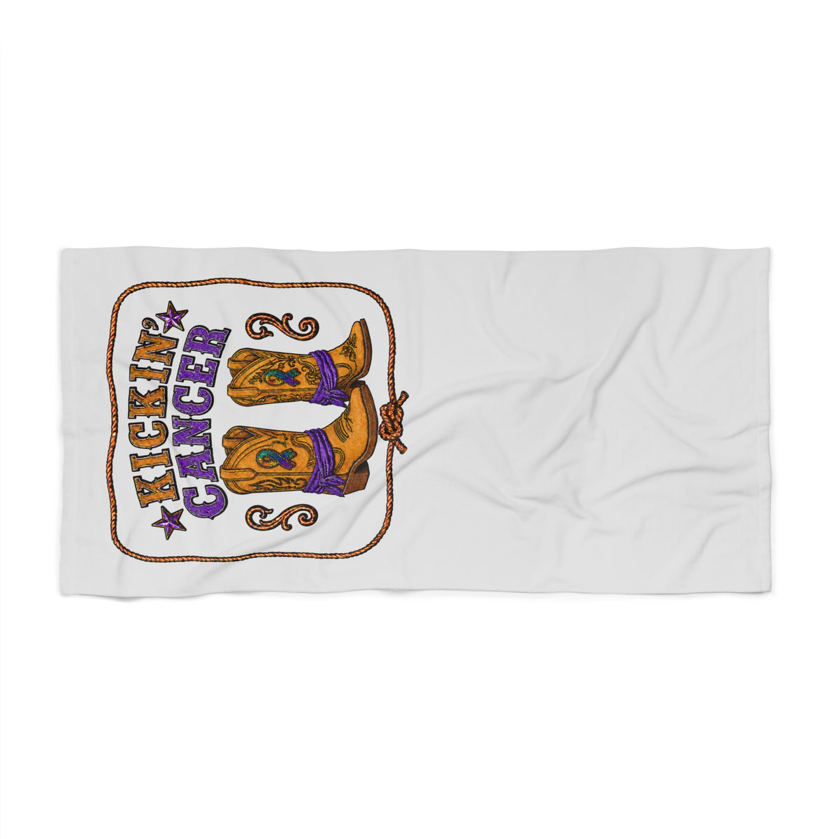 Beach towel laid flat with Kickin' Cancer western-inspired boot design