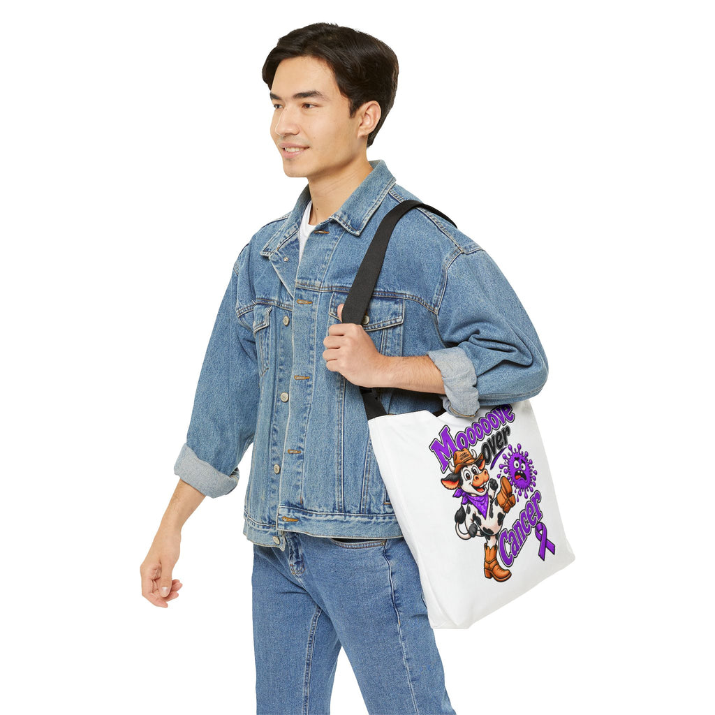 Moooove Over Cancer tote bag worn over the shoulder with cow artwork visible