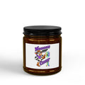 Moooove Over Cancer soy candle in an amber glass jar with a black lid