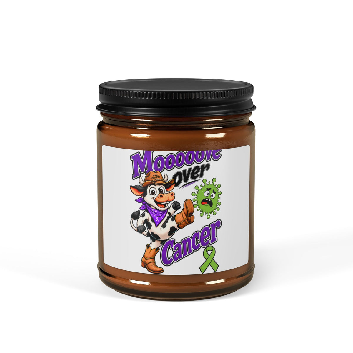 Front view of Moooove Over Cancer soy candle in an amber glass jar with awareness ribbon label