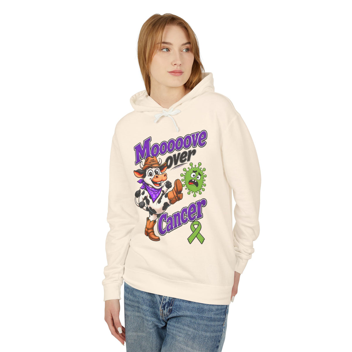 Woman modeling the Moooove Over Cancer hoodie with colorful cancer awareness artwork