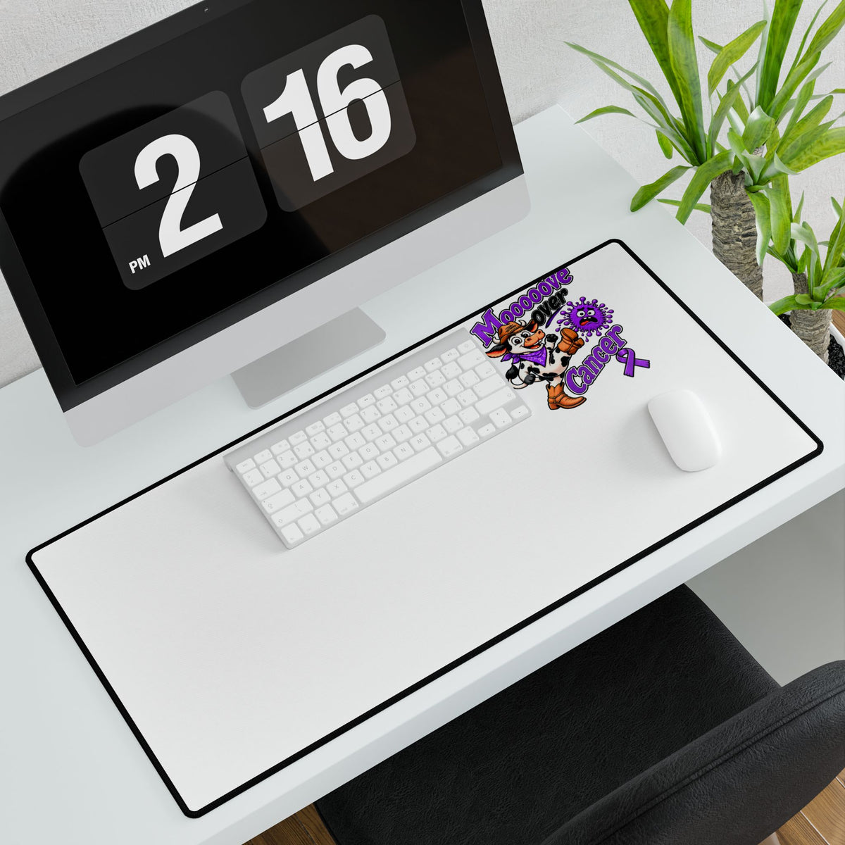 Moooove Over Cancer desk mat with keyboard and mouse on a modern workspace