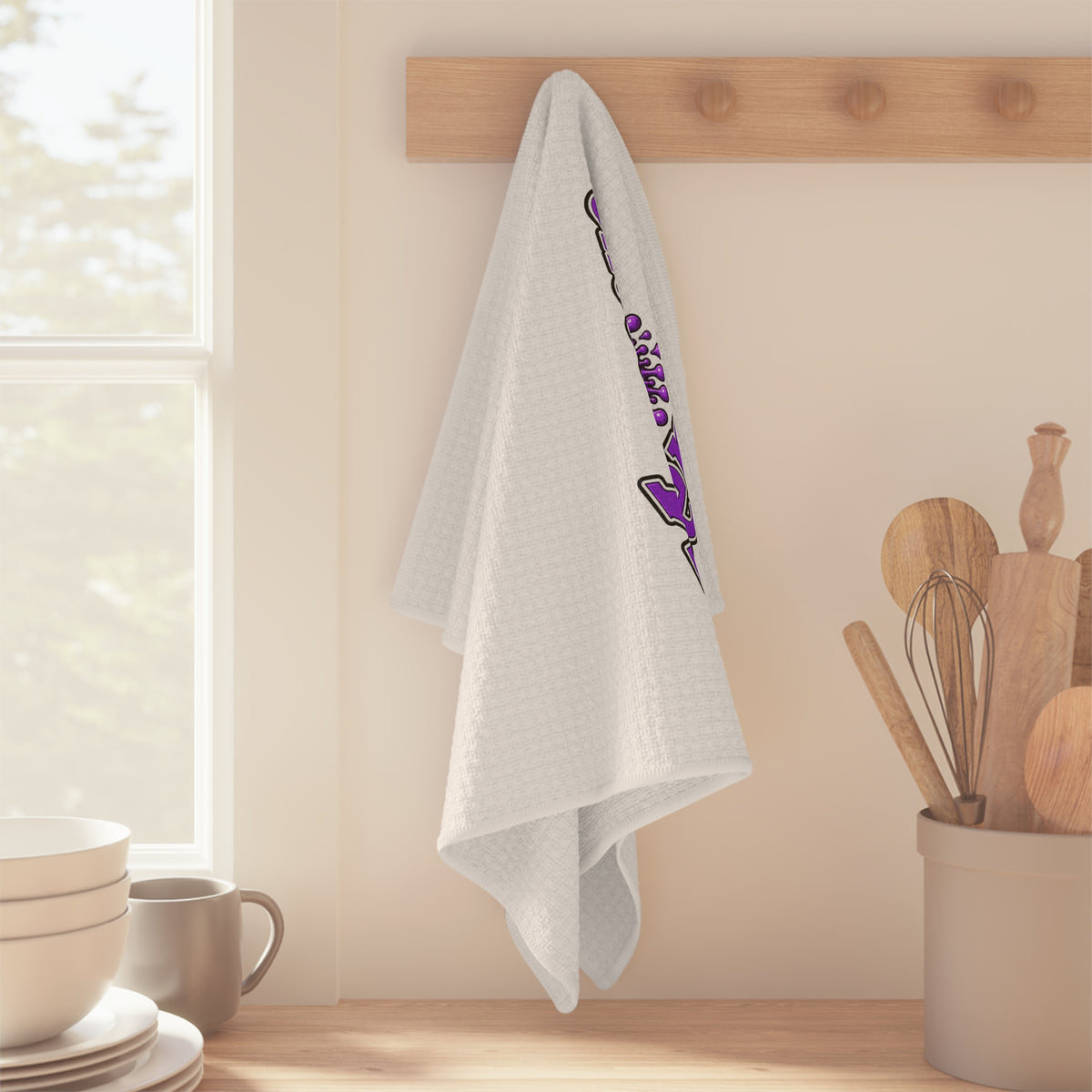 Moooove Over Cancer microfiber tea towel hanging in a kitchen with colorful ribbon design