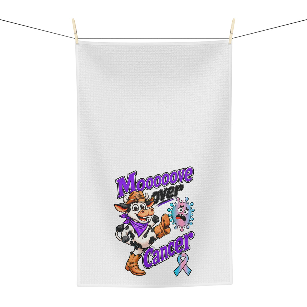 Moooove Over Cancer tea towel hanging outdoors with cow character and colorful ribbon design