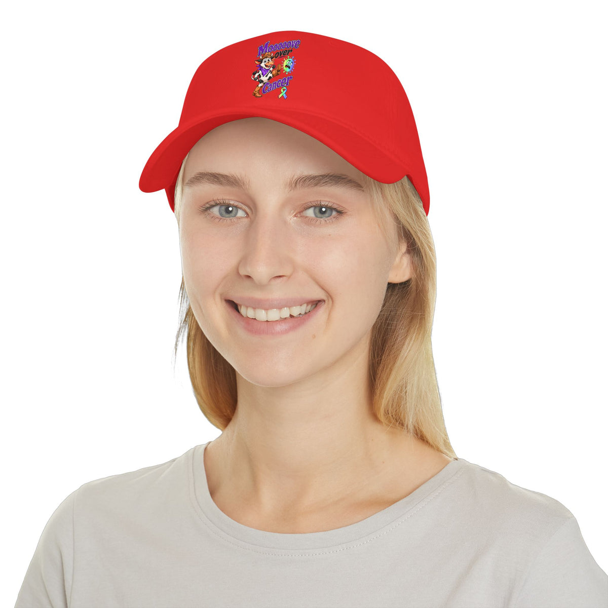 Model wearing the red Moooove Over Cancer baseball hat