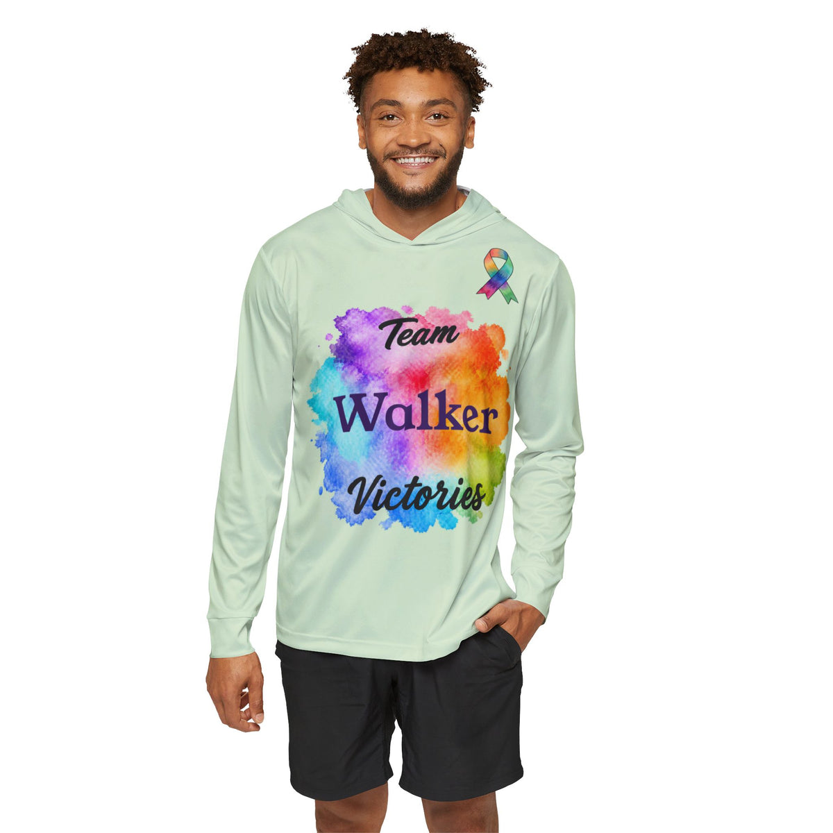 Model wearing a light green Team Victories hoodie with colourful chest artwork