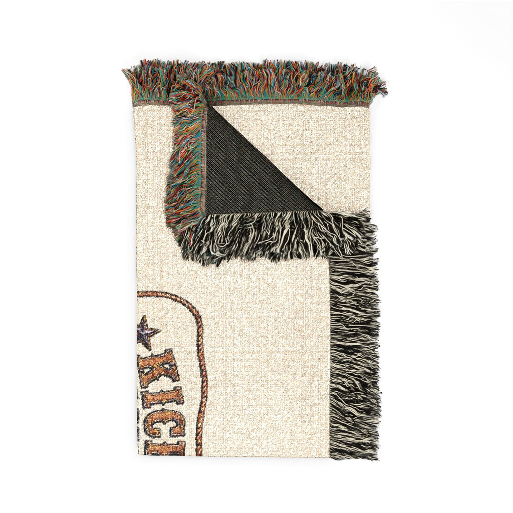 Detailed blanket corner showing woven texture, colorful fringe, and the reverse side