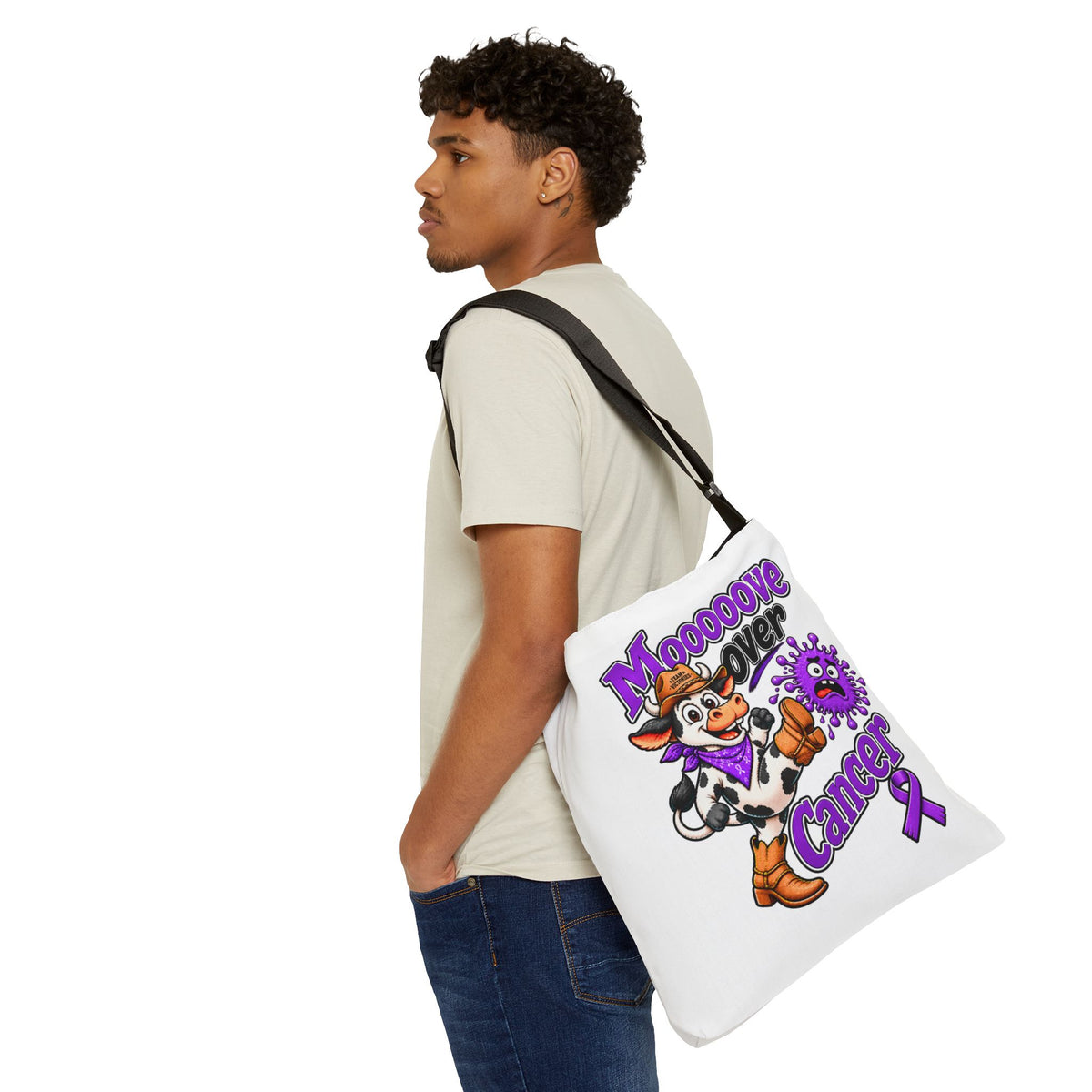 Moooove Over Cancer tote bag worn crossbody with cow and ribbon design