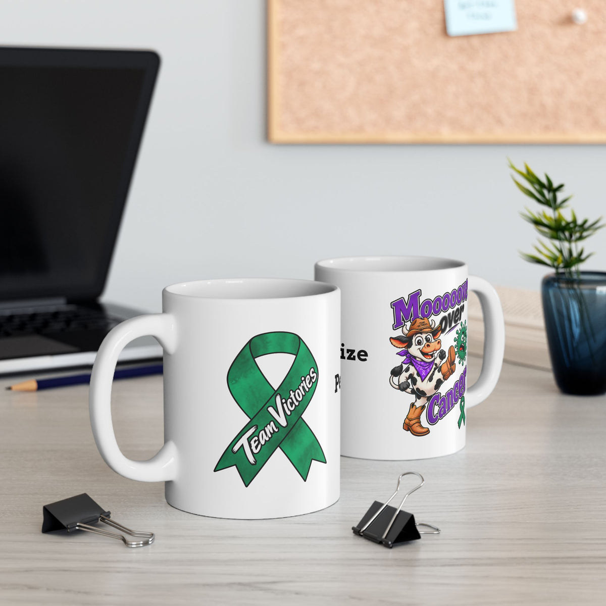 Moooove Over Cancer and Team Victories mugs displayed together on a desk