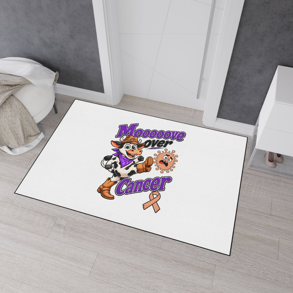 Moooove Over Cancer mat displayed near a doorway with cow artwork and awareness ribbon