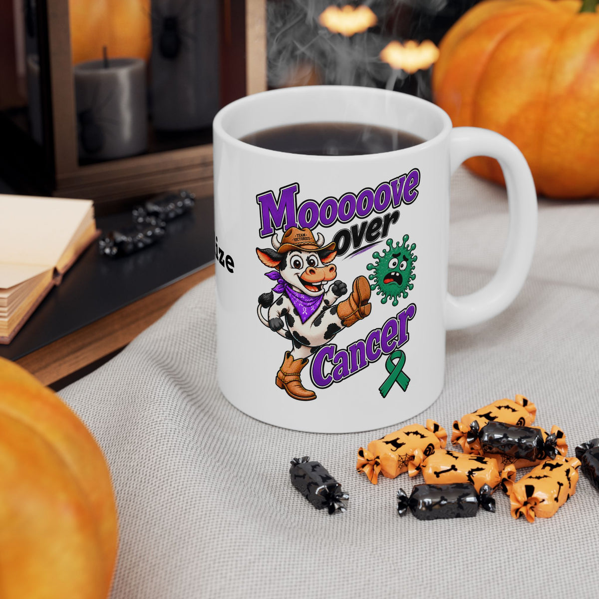 Moooove Over Cancer mug with cow artwork and Liver Cancer awareness ribbon beside coffee