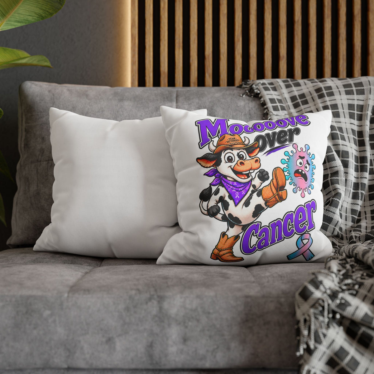 Moooove Over Cancer pillow cover styled on a sofa with a blanket