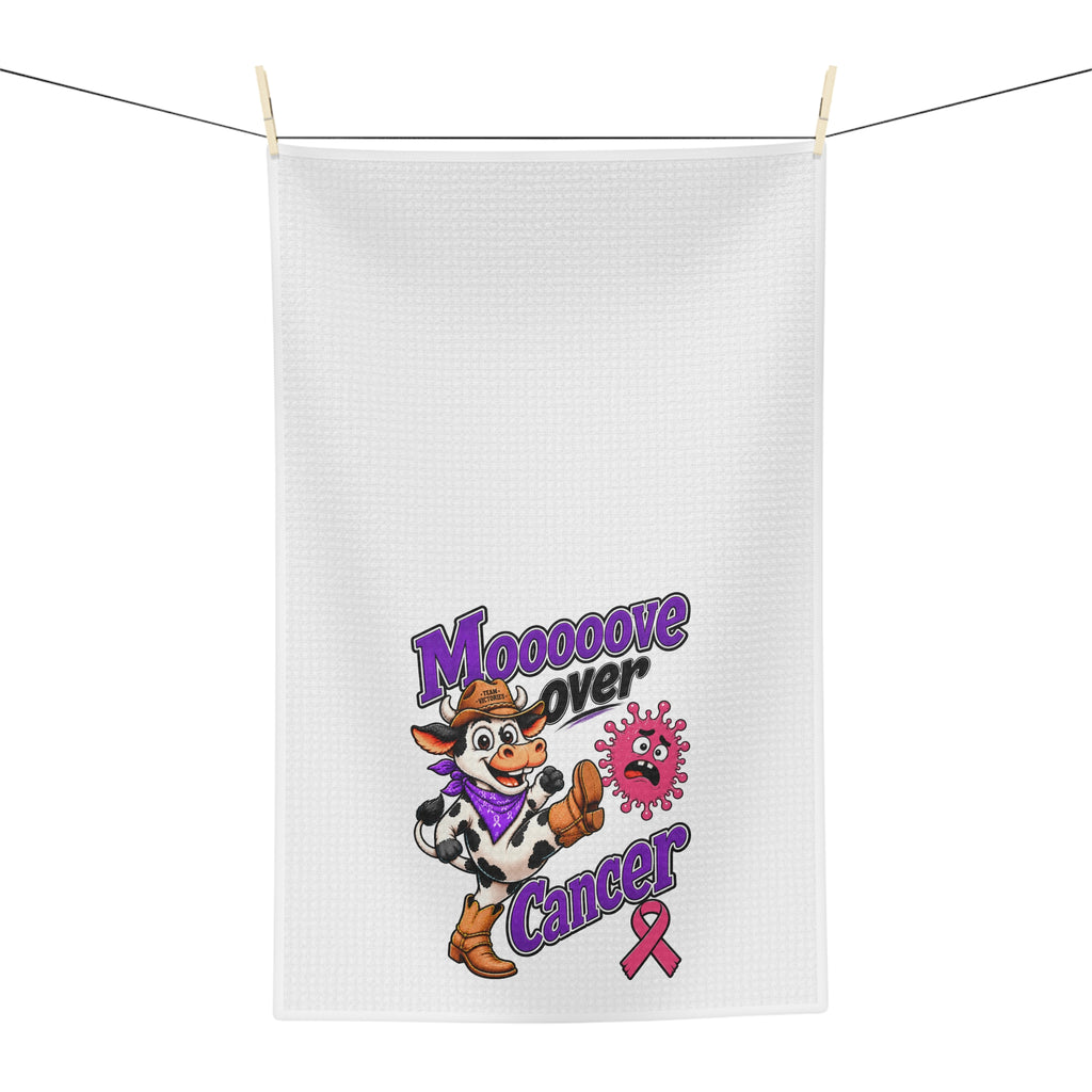 Moooove Over Cancer tea towel hanging outdoors with purple lettering and pink ribbon design
