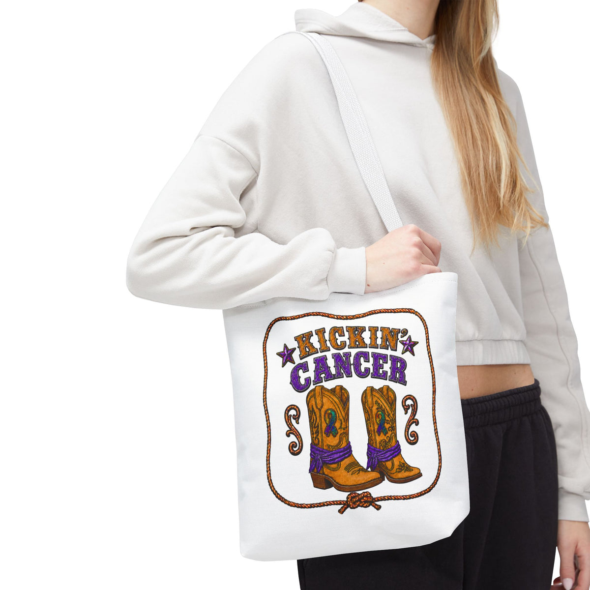 Person wearing a Kickin' Cancer cowboy boot tote bag with white handles