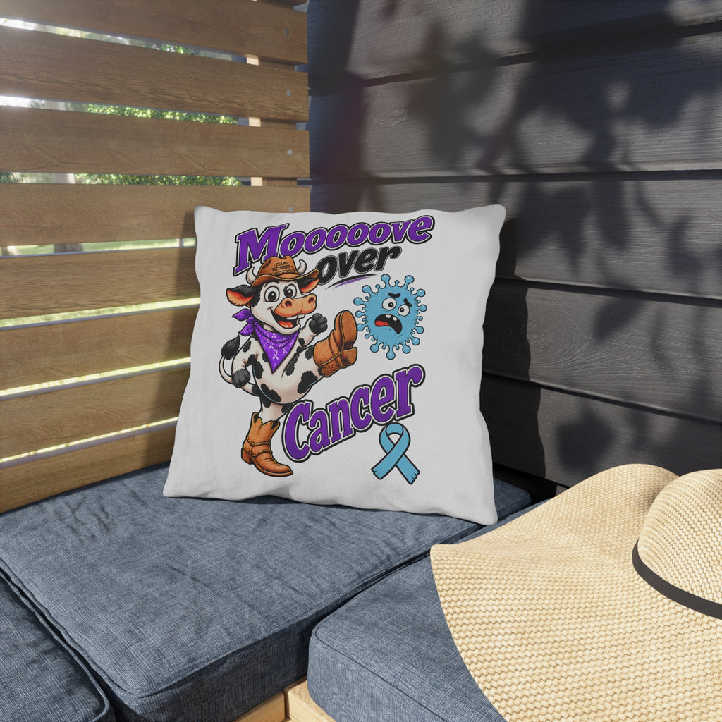 Moooove Over Cancer outdoor decorative pillow with blue ribbon on patio seating