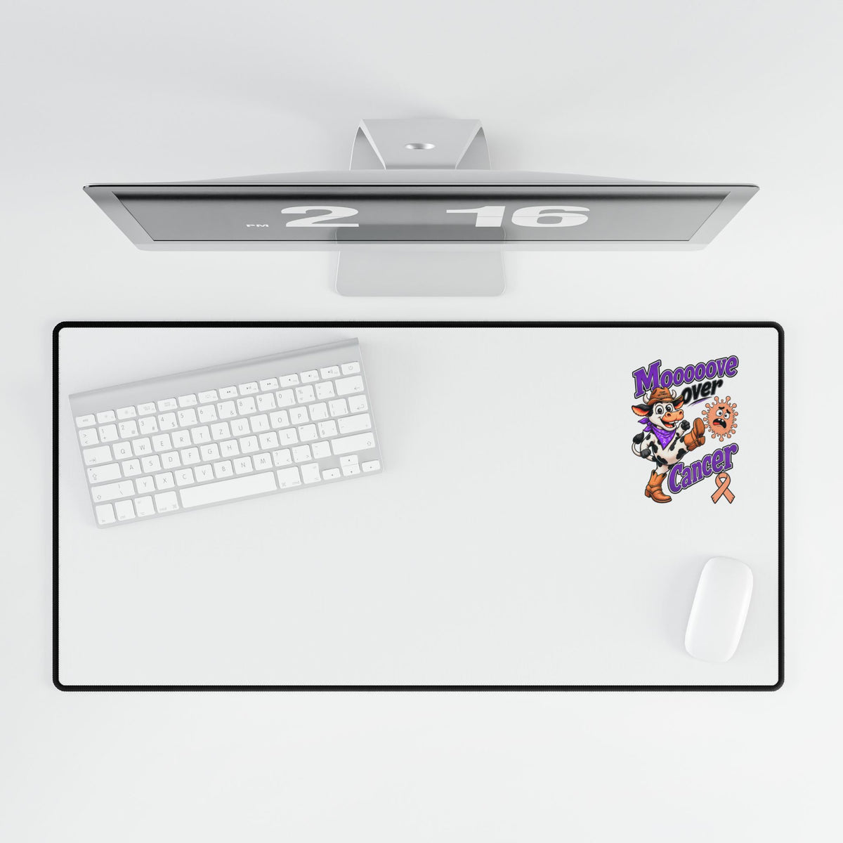 Moooove Over Cancer extended mouse pad shown beneath a monitor and keyboard