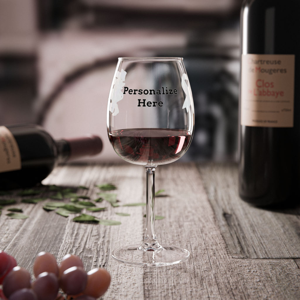 Personalized Moooove Over Cancer wine glass displayed with wine bottles