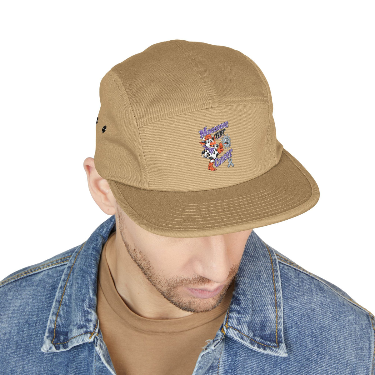 Person wearing tan Moooove Over Cancer cap showing front embroidered artwork