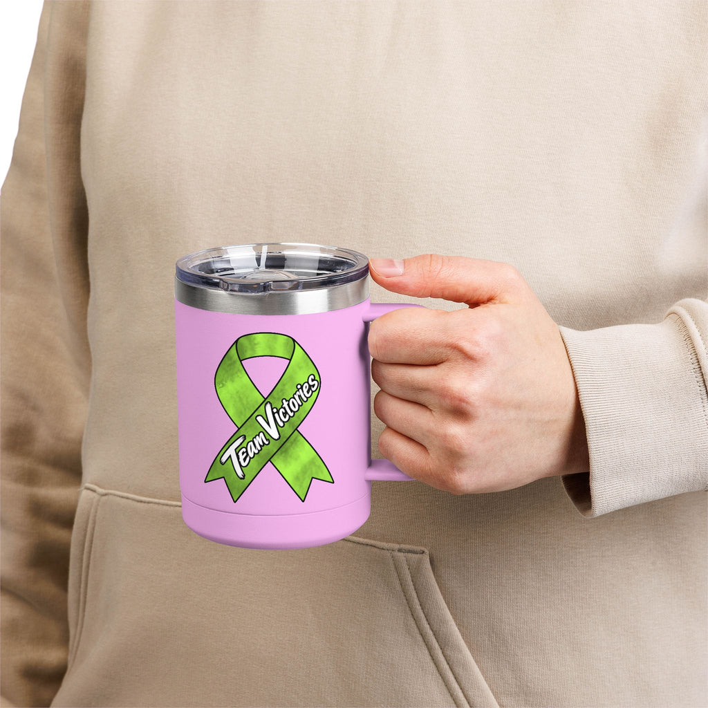 Person holding pink Team Victories mug with Non-Hodgkin/Lymphoma Cancer awareness ribbon